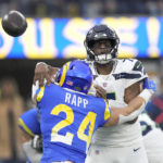 
              Seattle Seahawks quarterback Geno Smith (7) throws under pressure from Los Angeles Rams safety Taylor Rapp (24) during the first half of an NFL football game Sunday, Dec. 4, 2022, in Inglewood, Calif. (AP Photo/Mark J. Terrill)
            