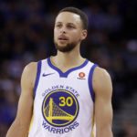 
              FILE - Golden State Warriors guard Stephen Curry stands on the court during an NBA basketball game against the Brooklyn Nets in Oakland, Calif., March 6, 2018. The bankruptcy of FTX and the arrest of its founder and former CEO are raising new questions about the role celebrity athletes such as Tom Brady, Curry, Naomi Osaka and others played in lending legitimacy to the largely unregulated landscape of crypto, while also reframing the conversation about just how costly blind loyalty to favorite players or teams can be for the average fan. (AP Photo/Jeff Chiu, File)
            