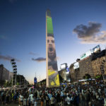 
              Argentine soccer fans gather at the Obelisk landmark during a rally in support of the national soccer team, a day ahead of the World Cup final against France, in Buenos Aires, Argentina, Saturday, Dec. 17, 2022.  (AP Photo/Rodrigo Abd)
            