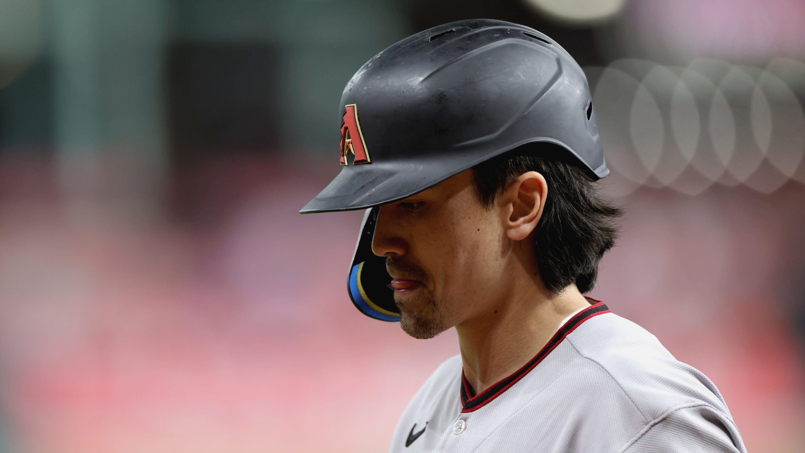 Corbin Carroll #7 of the Arizona Diamondbacks walks to the dugout after being struck out by Luis Ga...