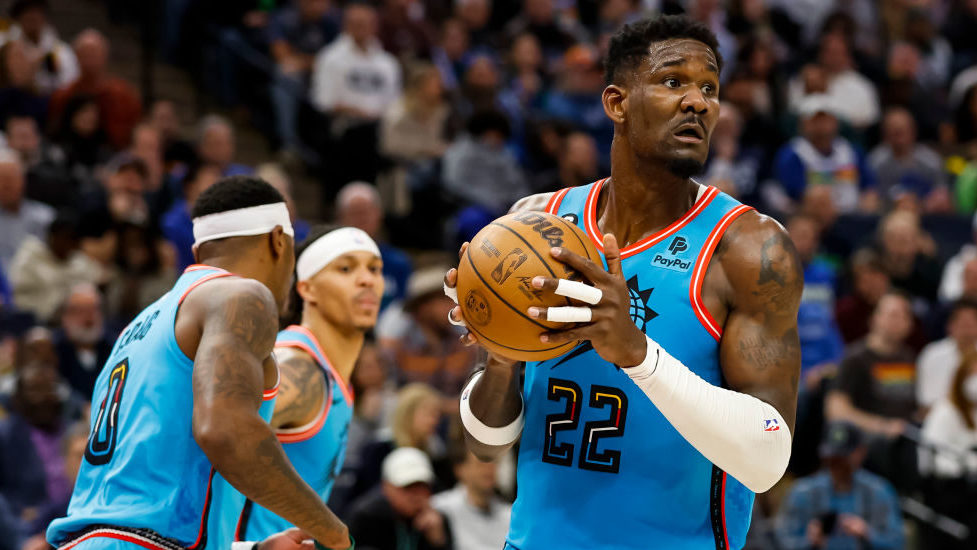 Deandre Ayton #22 of the Phoenix Suns rebounds the ball against the Minnesota Timberwolves in the s...