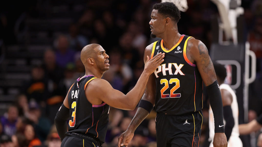 Chris Paul #3 of the Phoenix Suns talks with Deandre Ayton #22 during the first half of the NBA gam...