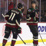 Nick Bjugstad #17 of the Arizona Coyotes celebrates with Dylan Guenther #11 after scoring a goal against the Detroit Red Wings during the second period of the NHL game at Mullett Arena on January 17, 2023 in Tempe, Arizona. (Photo by Christian Petersen/Getty Images)