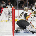 Vegas Golden Knights goaltender Logan Thompson (36) makes a save against a shot by Arizona Coyotes left wing Michael Carcone (53) as Golden Knights defenseman Brayden McNabb (3) looks on during the third period of an NHL hockey game in Tempe, Ariz., Sunday, Jan. 22, 2023. (AP Photo/Ross D. Franklin)