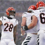 Cincinnati Bengals running back Joe Mixon (28) celebrates with teammates after a touchdown by tight end Hayden Hurst (88) against the Buffalo Bills during the first quarter of an NFL division round football game, Sunday, Jan. 22, 2023, in Orchard Park, N.Y. (AP Photo/Seth Wenig)