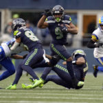 
              Seattle Seahawks running back Kenneth Walker III (9) runs against the Los Angeles Rams during the second half of an NFL football game Sunday, Jan. 8, 2023, in Seattle. (AP Photo/Abbie Parr)
            