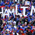 
              Fans hold a sign in support of Buffalo Bills safety Damar Hamlin during the second half of an NFL football game against the New England Patriots, Sunday, Jan. 8, 2023, in Orchard Park. Hamlin remains hospitalized after suffering a catastrophic on-field collapse in the team's previous game against the Cincinnati Bengals. (AP Photo/Jeffrey T. Barnes)
            