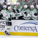 
              Dallas Stars center Ty Dellandrea (10) is congratulated after scoring scoring a goal against the San Jose Sharks during the first period of an NHL hockey game Wednesday, Jan. 18, 2023, in San Jose, Calif. (AP Photo/Tony Avelar)
            