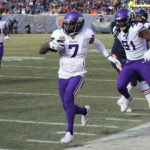 Minnesota Vikings cornerback Patrick Peterson (7) runs up field after intercepting a pass during the first half of an NFL football game against the Chicago Bears, Sunday, Jan. 8, 2023, in Chicago. (AP Photo/Charles Rex Arbogast)