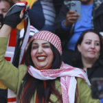 
              Iraqi soccer fan waves her country flag inside the stadium before the Arabian Gulf Cup football final between Iraq and Oman at the Basra International Stadium in Basra, Iraq, Thursday, Jan 19, 2023. (AP Photo/Nabil al-Jurani)
            