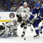 
              Tampa Bay Lightning center Steven Stamkos (91) battles with Los Angeles Kings center Blake Lizotte (46) after goaltender Jonathan Quick (32) made a save during the second period of an NHL hockey game Saturday, Jan. 28, 2023, in Tampa, Fla. (AP Photo/Chris O'Meara)
            