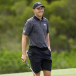 
              Jordan Spieth smiles towards the fans on the 18th green during the Tournament of Champions pro-am golf event, Wednesday, Jan. 4, 2023, at Kapalua Plantation Course in Kapalua, Hawaii. (AP Photo/Matt York)
            