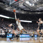 
              Michigan State guard Jaden Akins (3) makes next to Purdue guard Braden Smith during the second half of an NCAA college basketball game, Monday, Jan. 16, 2023, in East Lansing, Mich. (AP Photo/Carlos Osorio)
            