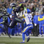 Seattle Seahawks safety Quandre Diggs (6) intercepts a pass intended for Los Angeles Rams wide receiver Van Jefferson (12) during the overtime of an NFL football game Sunday, Jan. 8, 2023, in Seattle. (AP Photo/Stephen Brashear)