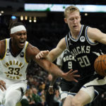 Indiana Pacers' Myles Turner (33) reacts as Milwaukee Bucks' AJ Green controls the ball during the first half of an NBA basketball game, Monday, Jan. 16, 2023, in Milwaukee. (AP Photo/Aaron Gash)