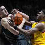 Purdue center Zach Edey (15) and Maryland forward Ike Cornish (20) fight for a rebound during the first half of an NCAA college basketball game in West Lafayette, Ind., Sunday, Jan. 22, 2023. (AP Photo/Michael Conroy)