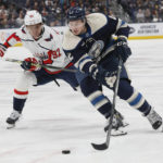 
              Columbus Blue Jackets' Andrew Peeke, right, carries the puck past Washington Capitals' Evgeny Kuznetsov during the second period of an NHL hockey game Thursday, Jan. 5, 2023, in Columbus, Ohio. (AP Photo/Jay LaPrete)
            