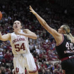 
              Indiana's Mackenzie Holmes (54) puts up a shot against Nebraska's Alexis Markowski (40) during the second half of an NCAA college basketball game, Sunday, Jan. 1, 2023, in Bloomington, Ind. (AP Photo/Darron Cummings)
            