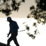 
              Maverick McNealy walks onto the green on the eighth hole of the South Course at Torrey Pines during the second round of the Farmers Insurance Open golf tournament, Thursday, Jan. 26, 2023, in San Diego. (AP Photo/Gregory Bull)
            