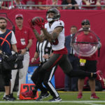 
              Tampa Bay Buccaneers wide receiver Mike Evans catches a touchdown pass during the first half of an NFL football game between the Carolina Panthers and the Tampa Bay Buccaneers on Sunday, Jan. 1, 2023, in Tampa, Fla. (AP Photo/Chris O'Meara)
            
