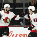 Ottawa Senators center Derick Brassard, left, celebrates with center Jacob Lucchini (36) after scoring against the Arizona Coyotes during the first period of an NHL hockey game in Tempe, Ariz., Thursday, Jan. 12, 2023. (AP Photo/Ross D. Franklin)