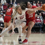Stanford forward Cameron Brink, left, and Utah forward Alissa Pili compete for possession of the ball during the first half of an NCAA college basketball game in Stanford, Calif., Friday, Jan. 20, 2023. (AP Photo/Godofredo A. Vásquez)
