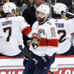 Florida Panthers' Aaron Ekblad (5) returns to the bench after scoring against the Pittsburgh Pirates during the second period of an NHL hockey game in Pittsburgh, Tuesday, Jan. 24, 2023. (AP Photo/Gene J. Puskar)