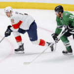 
              Florida Panthers center Sam Reinhart (13) looks to pass the puck as Dallas Stars center Joe Pavelski (16) defends in the second period of an NHL hockey game in Dallas, Sunday, Jan. 8, 2023. (AP Photo/Gareth Patterson)
            