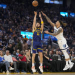 
              Golden State Warriors forward Klay Thompson (11) shoots a 3-point basket next to Memphis Grizzlies forward Brandon Clarke during the first half of an NBA basketball game in San Francisco, Wednesday, Jan. 25, 2023. (AP Photo/Godofredo A. Vásquez)
            