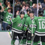 
              Dallas Stars left wing Jason Robertson, left, celebrates with teammates after scoring a goal in the first period of an NHL hockey game against the Florida Panthers in Dallas, Sunday, Jan. 8, 2023. (AP Photo/Gareth Patterson)
            