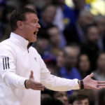 Kansas head coach Bill Self talks to his players during the first half of an NCAA college basketball game against Iowa State Saturday, Jan. 14, 2023, in Lawrence, Kan. (AP Photo/Charlie Riedel)