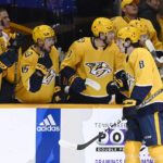 Nashville Predators center Cody Glass (8) is congratulated after scoring a goal against the Montreal Canadiens during the first period of an NHL hockey game Tuesday, Jan. 3, 2023, in Nashville, Tenn. (AP Photo/Mark Zaleski)