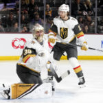 Vegas Golden Knights goaltender Logan Thompson (36) gives up a goal to Arizona Coyotes' Dylan Guenther (not shown) as Golden Knights defenseman Ben Hutton (17) looks on during the first period of an NHL hockey game in Tempe, Ariz., Sunday, Jan. 22, 2023. (AP Photo/Ross D. Franklin)