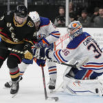 
              Vegas Golden Knights center Paul Cotter (43) scores around Edmonton Oilers goaltender Jack Campbell (36) during the second period of an NHL hockey game Saturday, Jan. 14, 2023, in Las Vegas. (AP Photo/John Locher)
            
