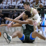 Michigan State guard A.J. Hoggard (11) and Purdue guard Braden Smith (3) go for a loose ball during the first half of an NCAA college basketball game in West Lafayette, Ind., Sunday, Jan. 29, 2023. (AP Photo/Michael Conroy)