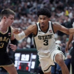 
              Michigan State guard Jaden Akins (3) drives as Purdue guard Braden Smith (3) defends during the second half of an NCAA college basketball game, Monday, Jan. 16, 2023, in East Lansing, Mich. (AP Photo/Carlos Osorio)
            