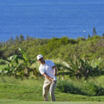 
              Collin Morikawa chips onto the 14th green during the first round of the Tournament of Champions golf event, Thursday, Jan. 5, 2023, at Kapalua Plantation Course in Kapalua, Hawaii. (AP Photo/Matt York)
            