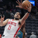 Houston Rockets guard Daishen Nix (15) makes a layup during the second half of an NBA basketball game against the Detroit Pistons, Saturday, Jan. 28, 2023, in Detroit. (AP Photo/Carlos Osorio)