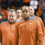 Texas interim head coach Rodney Terry walks the court with his staff following a win over Oklahoma State in an NCAA college basketball game Saturday, Jan. 7, 2023, in Stillwater, Okla. Texas defeated Oklahoma State 56-46. (AP Photo/Brody Schmidt)