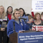 
              Former University of Kentucky swimmer Riley Gaines speaks at a rally on Thursday, Jan. 12, 2023, outside of the NCAA Convention in San Antonio. (AP Photo/Darren Abate)
            