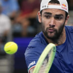 Italy's Matteo Berrettini plays a backhand return to United States' Taylor Fritz during the final of the United Cup tennis event in Sydney, Australia, Sunday, Jan. 8, 2023. (AP Photo/Mark Baker)