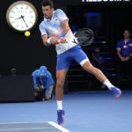 
              Novak Djokovic of Serbia plays a backhand return to Tommy Paul of the U.S. during their semifinal at the Australian Open tennis championship in Melbourne, Australia, Friday, Jan. 27, 2023. (AP Photo/Aaron Favila)
            