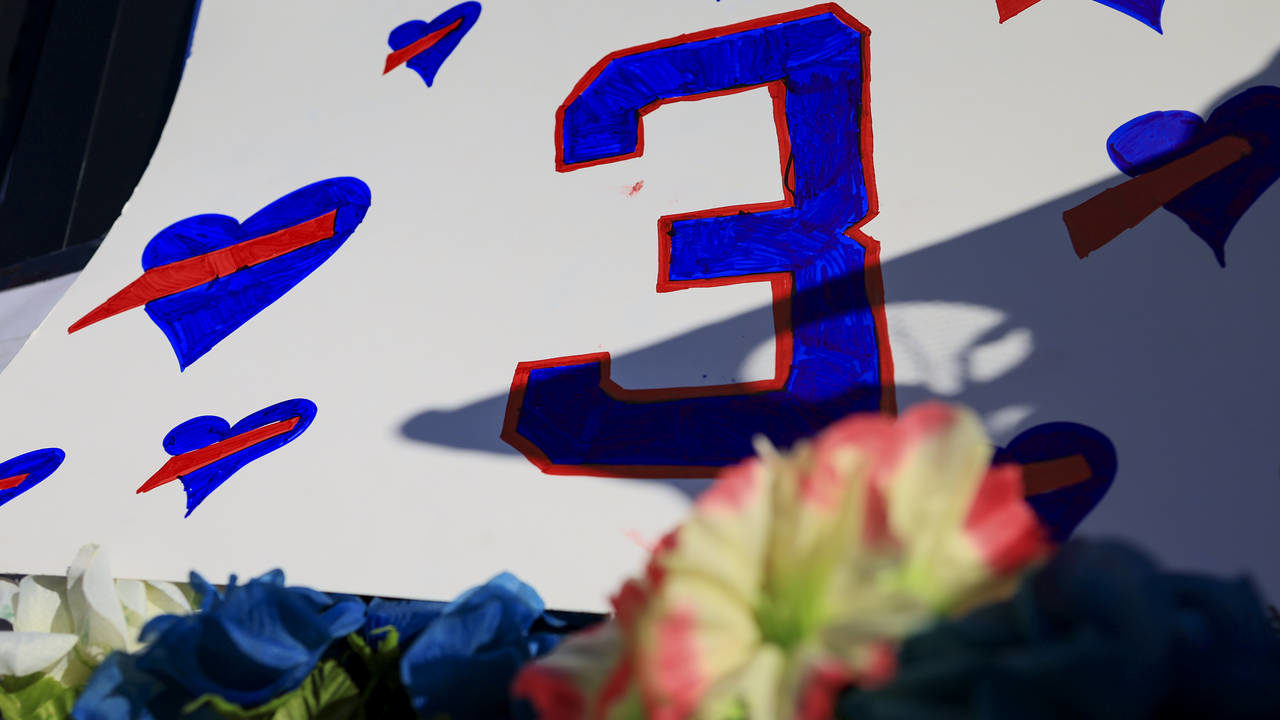 A sign with the number of Buffalo Bills' Damar Hamlin is seen for the display set-up outside of Uni...