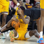 Arizona State guard Luther Muhammad shouts after getting a jump ball against Southern California forward VIncent Iwuchukwu, back right, during the first half of an NCAA college basketball game in Tempe, Ariz., Saturday, Jan. 21, 2023. (AP Photo/Ross D. Franklin)