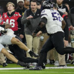 Georgia tight end Brock Bowers (19) is hit by TCU during the second half of the national championship NCAA College Football Playoff game, Monday, Jan. 9, 2023, in Inglewood, Calif. (AP Photo/Marcio Jose Sanchez)