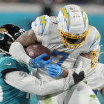 Los Angeles Chargers tight end Gerald Everett (7) runs against the Jacksonville Jaguars during the second half of an NFL wild-card football game, Saturday, Jan. 14, 2023, in Jacksonville, Fla. (AP Photo/Chris Carlson)