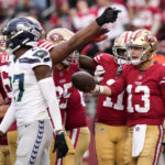 San Francisco 49ers quarterback Brock Purdy (13) celebrates after scoring a touchdown on a keeper against the Seattle Seahawks during the second half of an NFL wild card playoff football game in Santa Clara, Calif., Saturday, Jan. 14, 2023. (AP Photo/Godofredo A. Vásquez)