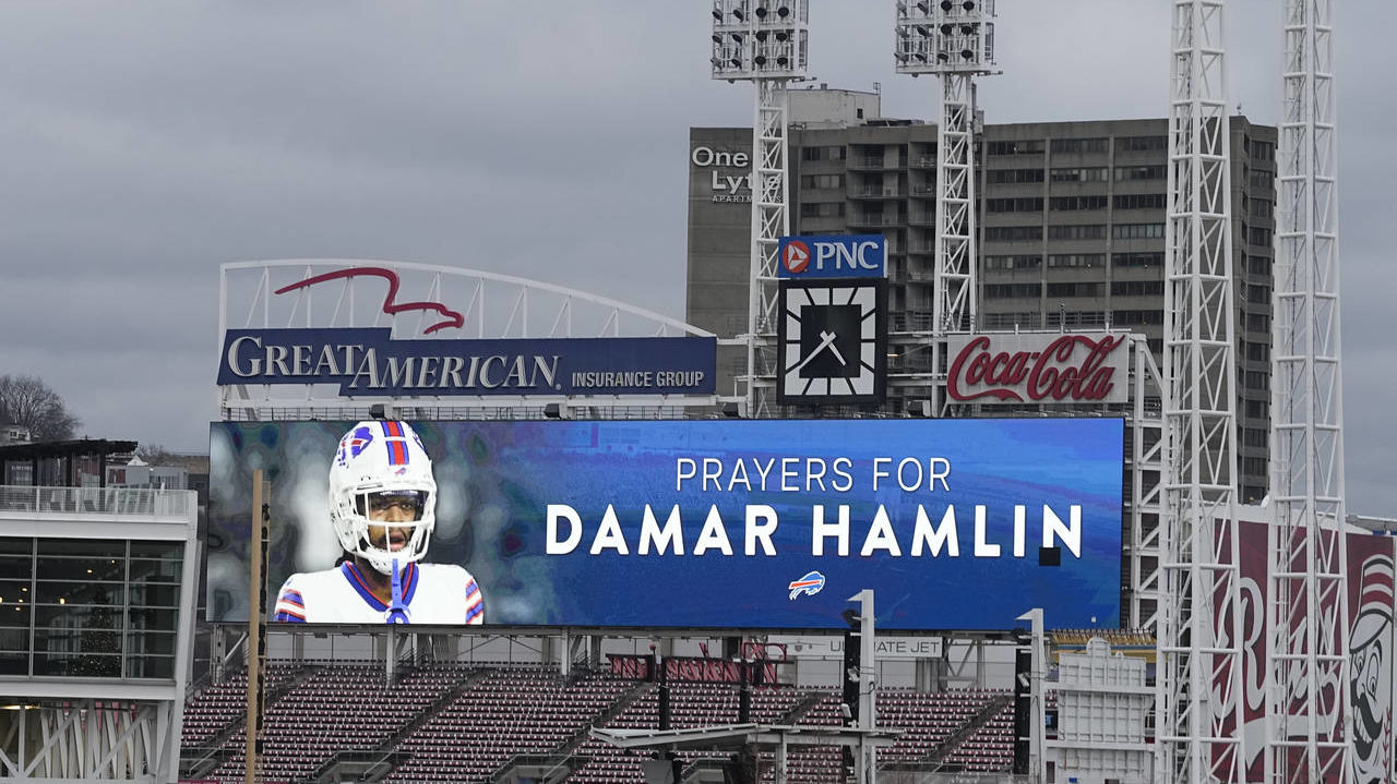 A scoreboard at Great American Ballpark displays a photo of Buffalo Bills' Damar Hamlin, Tuesday, J...