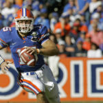 
              FILE - In this Nov. 17, 2007, file photo, Florida quarterback Tim Tebow scrambles during the second half of a football game against Florida Atlantic in Gainesville, Fla. Tebow was elected to the College Football Hall of Fame, Monday, Jan. 9, 2023. (AP Photo/John Raoux)
            