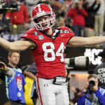 Georgia wide receiver Ladd McConkey (84) celebrates his touchdown against TCU during the second half of the national championship NCAA College Football Playoff game, Monday, Jan. 9, 2023, in Inglewood, Calif. (AP Photo/Ashley Landis)
